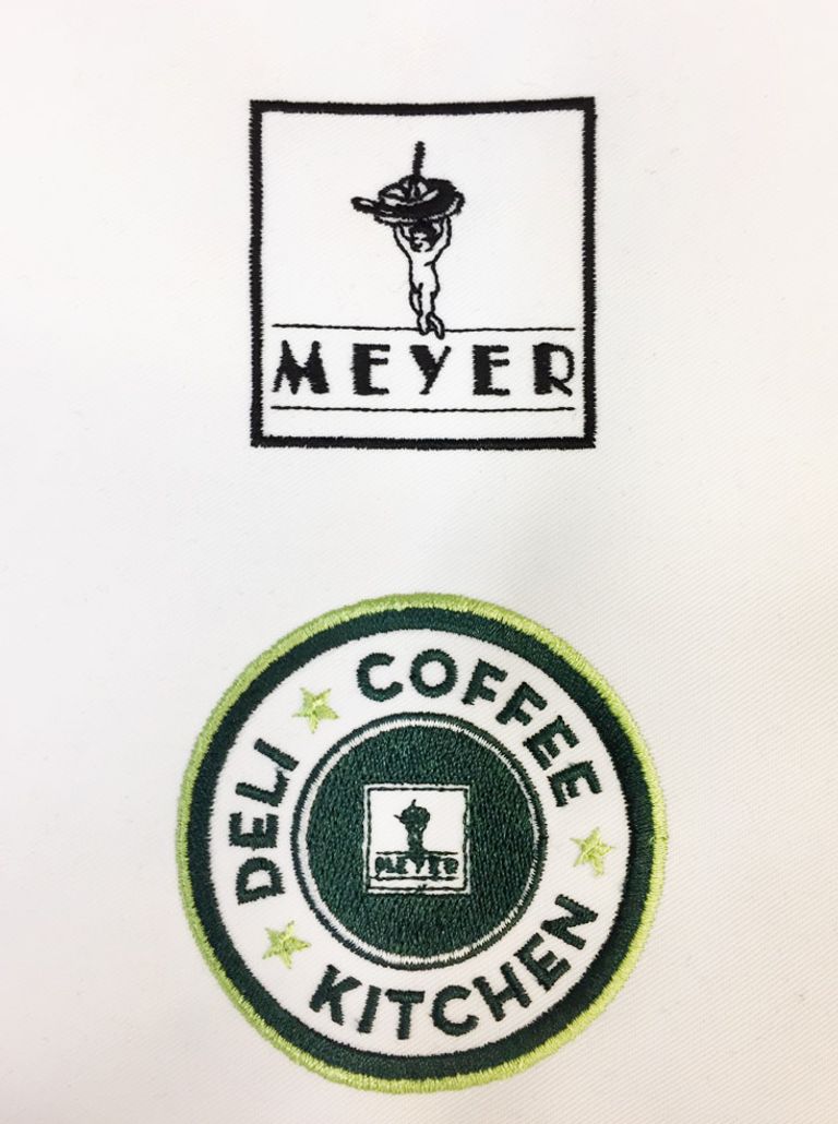 Detailaufnahme der Stickerei für Meyer Deli Coffee Kitchen